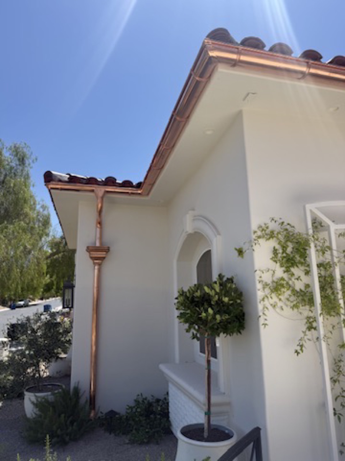 City Seamless half-round gutter with collection box and downspout drainage detail.