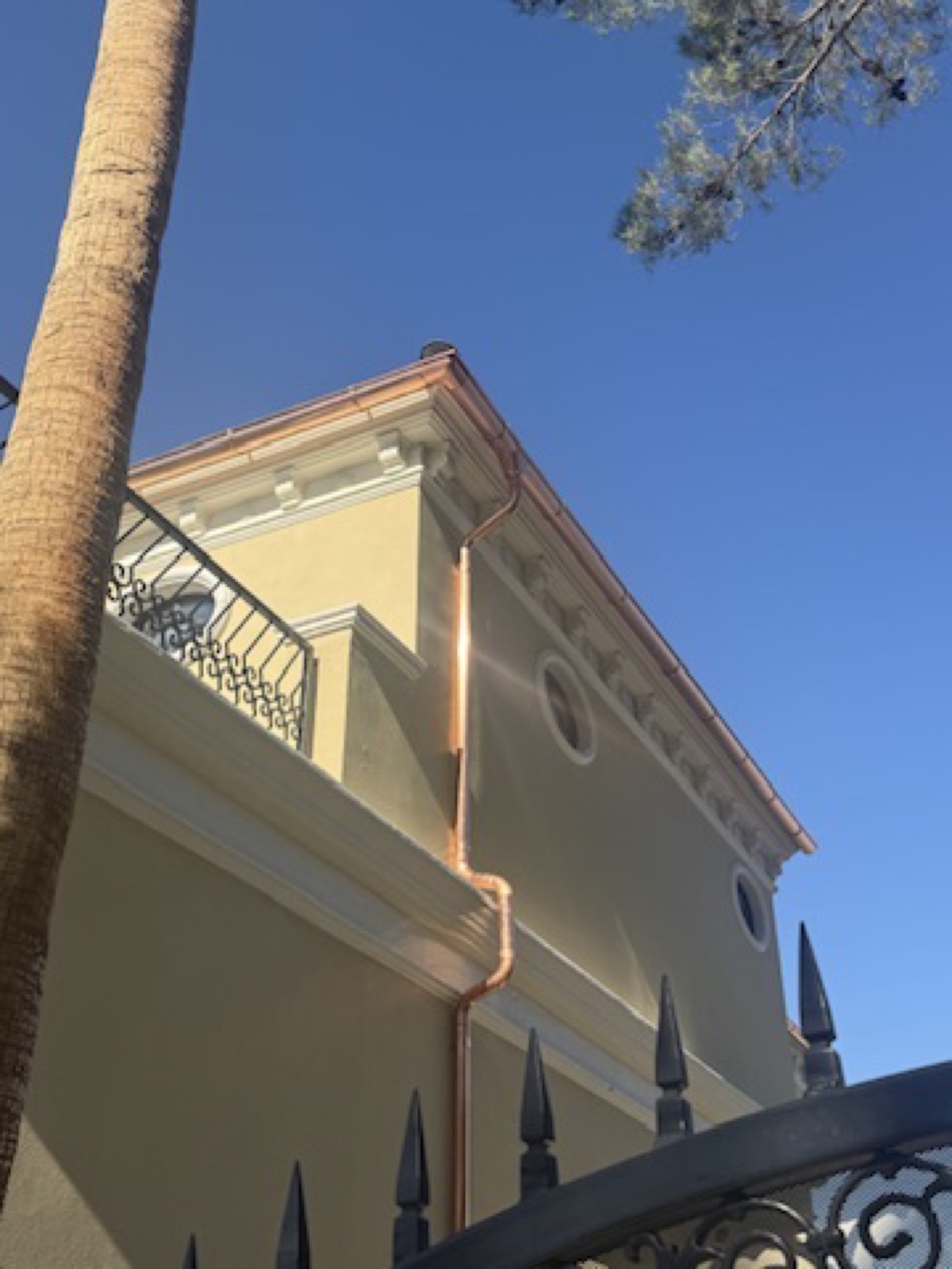 City Seamless half-round rain gutter with downspout routing on a custom home.