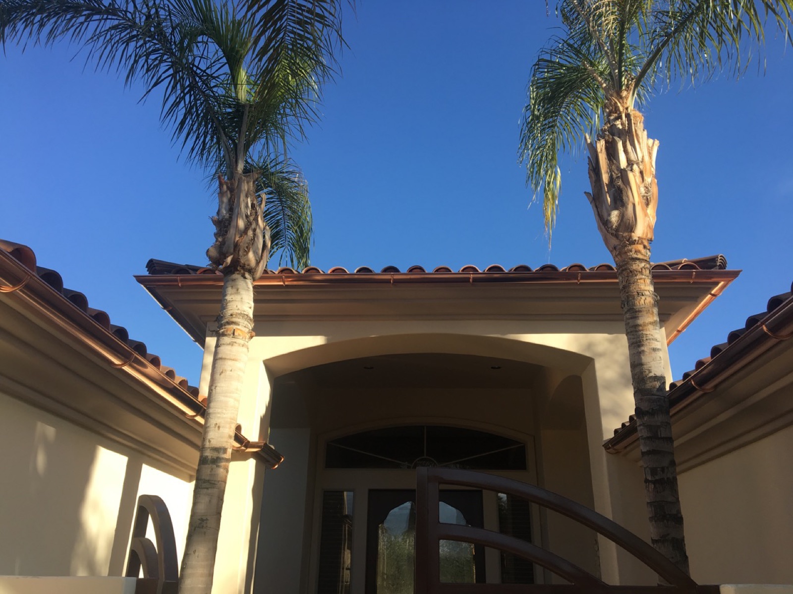 City Seamless half-round rain gutter installation on a custom home.