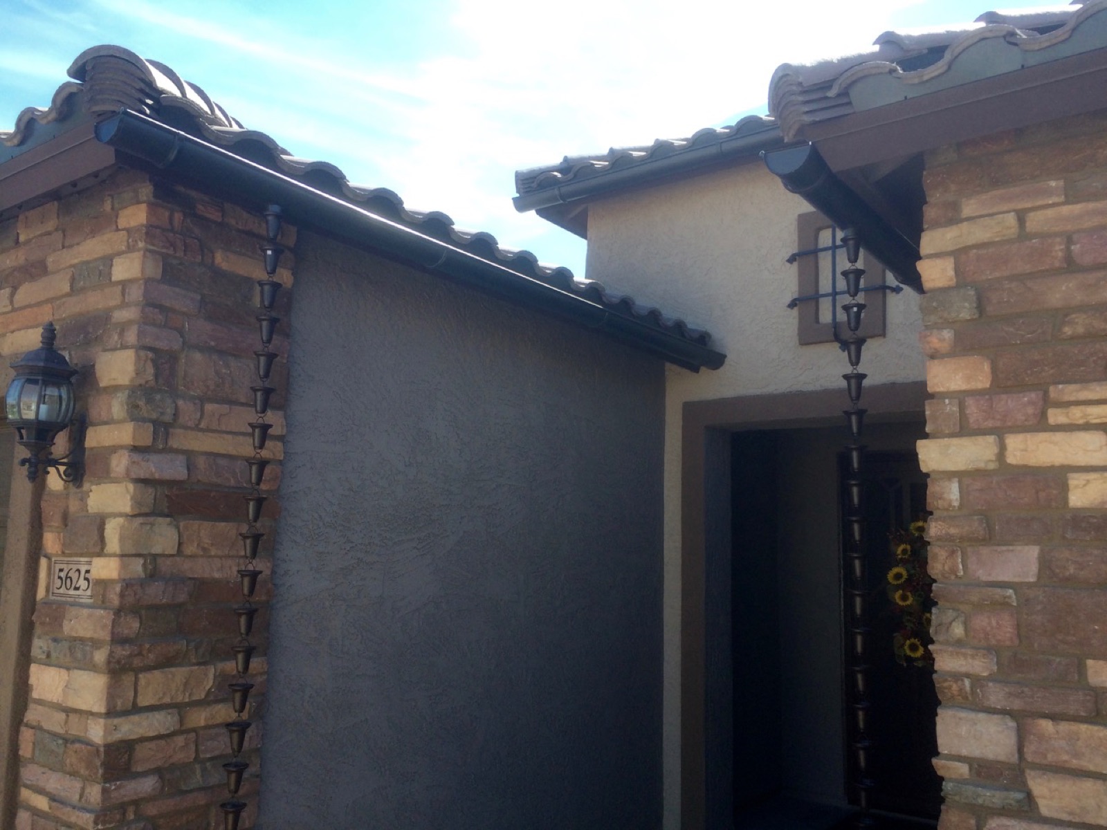 City Seamless half-round rain gutter installation on a custom home.