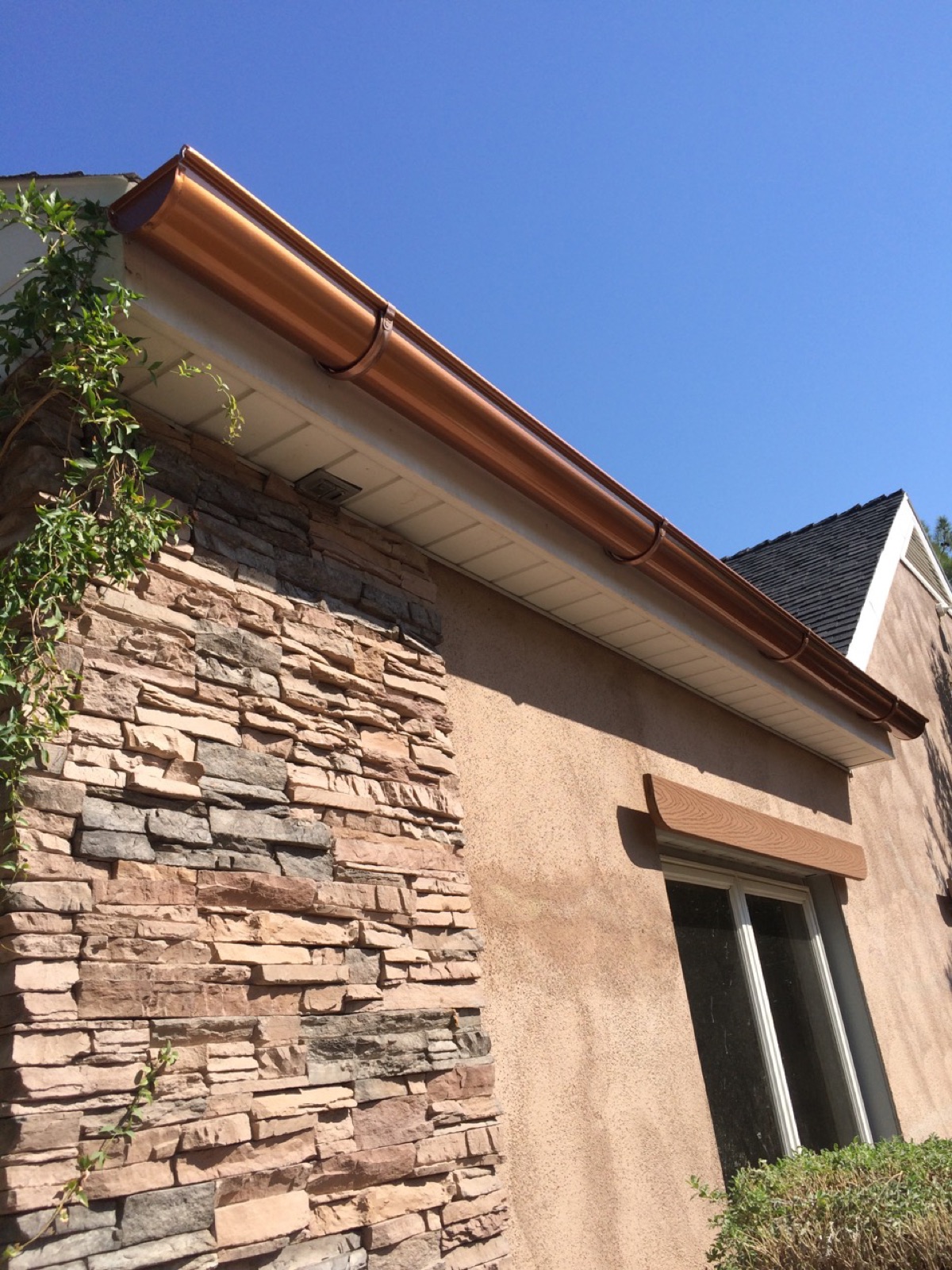 City Seamless half-round rain gutter installation on a custom home.