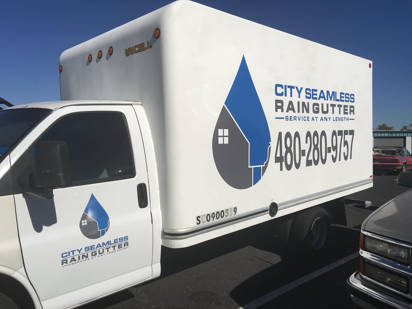 City Seamless rain gutter installation crew and equipment photo.
