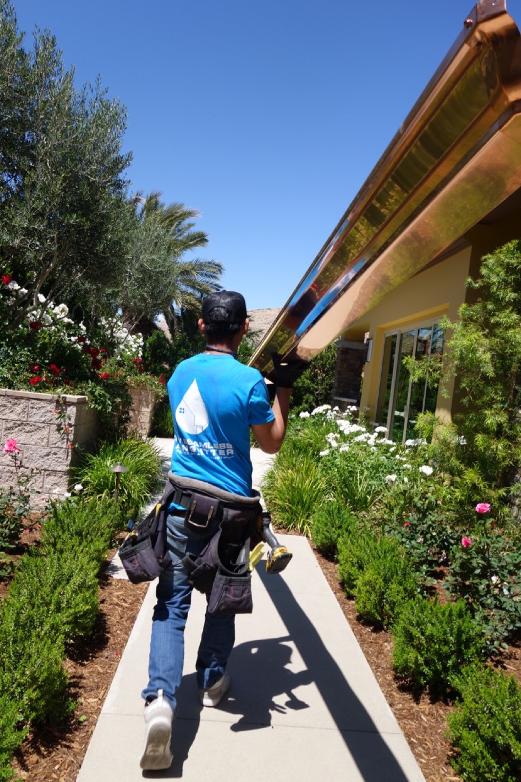 City Seamless rain gutter installation crew and equipment photo.