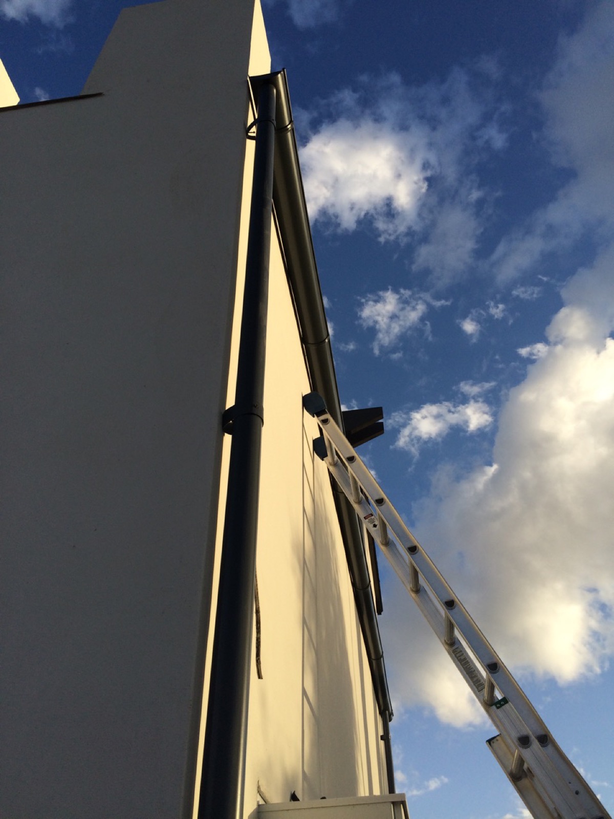 City Seamless rain gutter installation crew and equipment photo.