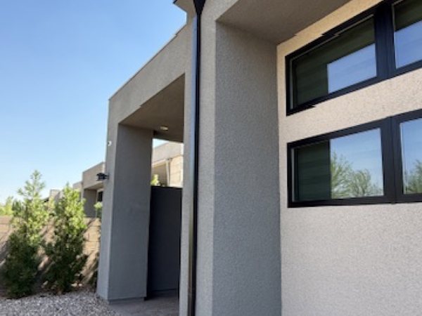 City Seamless rain gutter downspout installation detail.