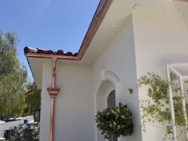 City Seamless half-round gutter with collection box and downspout drainage detail.
