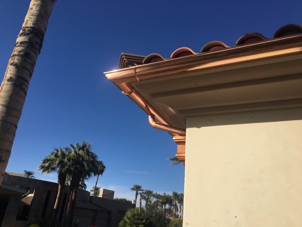 City Seamless half-round gutter with collection box and downspout drainage detail.