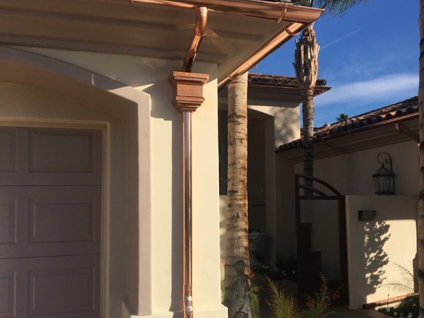 City Seamless half-round gutter with collection box and downspout drainage detail.