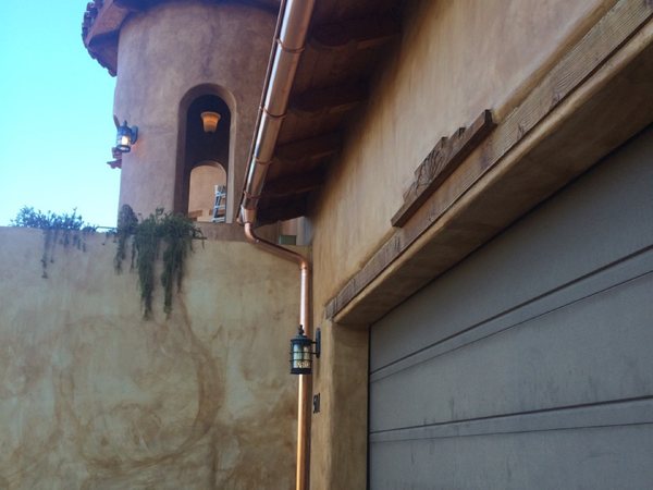 City Seamless half-round rain gutter installation on a custom home.
