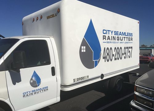 City Seamless rain gutter installation crew and equipment photo.